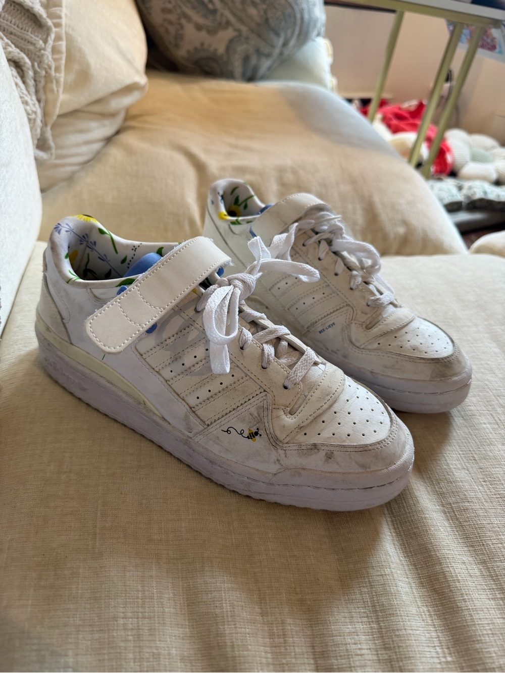 white adidas sneakers with bee detail